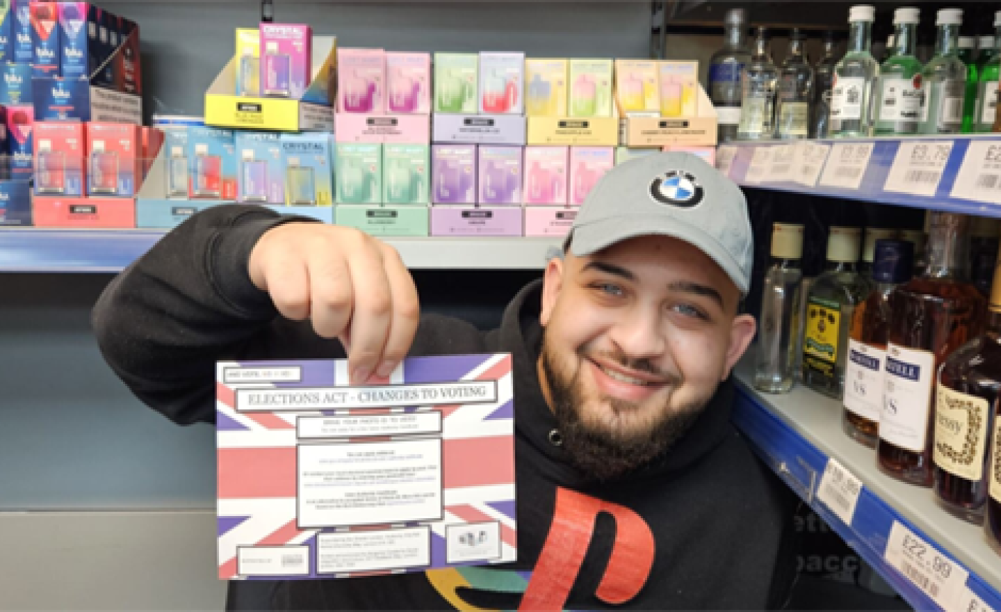 A man holding an information leaflet on voting changes