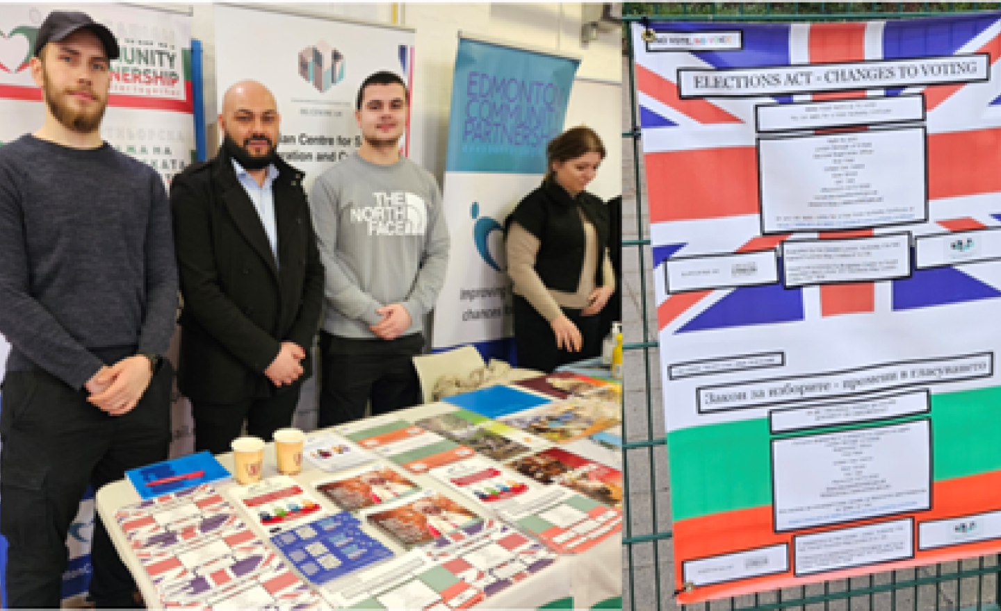 People standing behind a table of community information leaflets including photo Voter ID