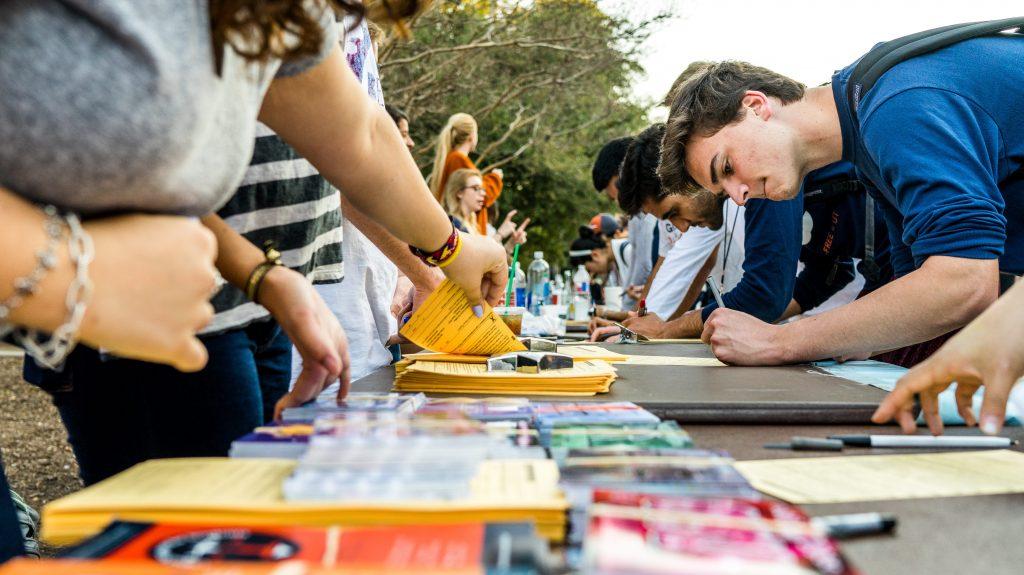 Group of people signing up